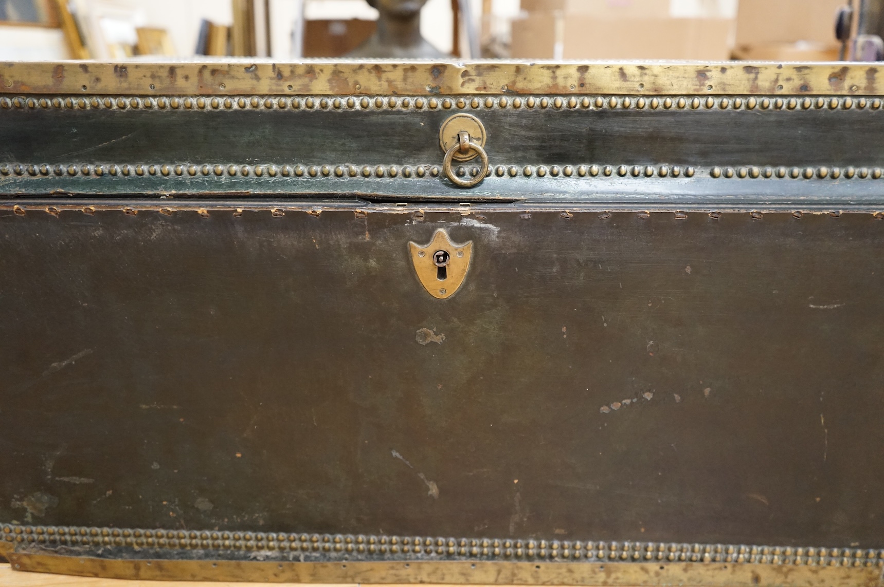 A 19th century Anglo Chinese camphor lined leather and brass studded trunk, lid detached, 85cm wide
